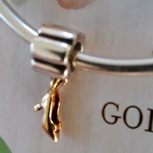 Retired authentic Pandora charm. Solid 14kt heel.